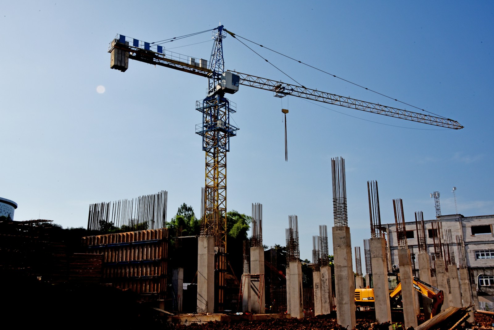 a construction site with a crane in the background