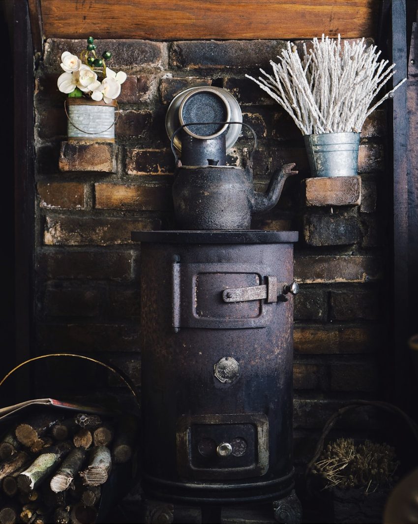 cast-iron teapot on wood burner