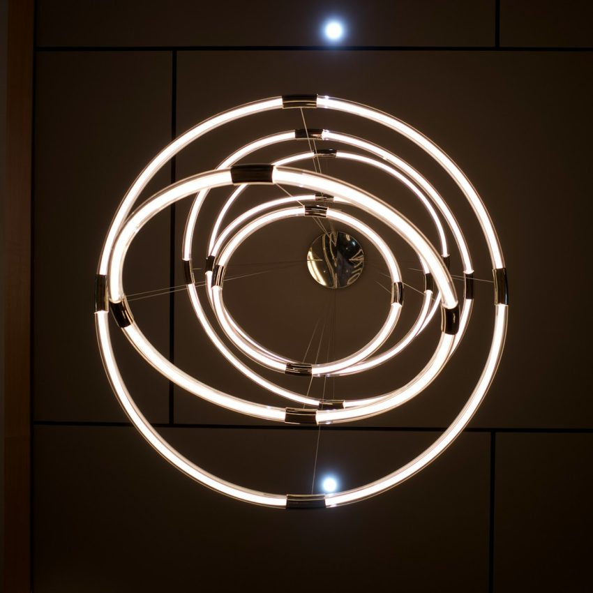 a circular light fixture hanging from the ceiling