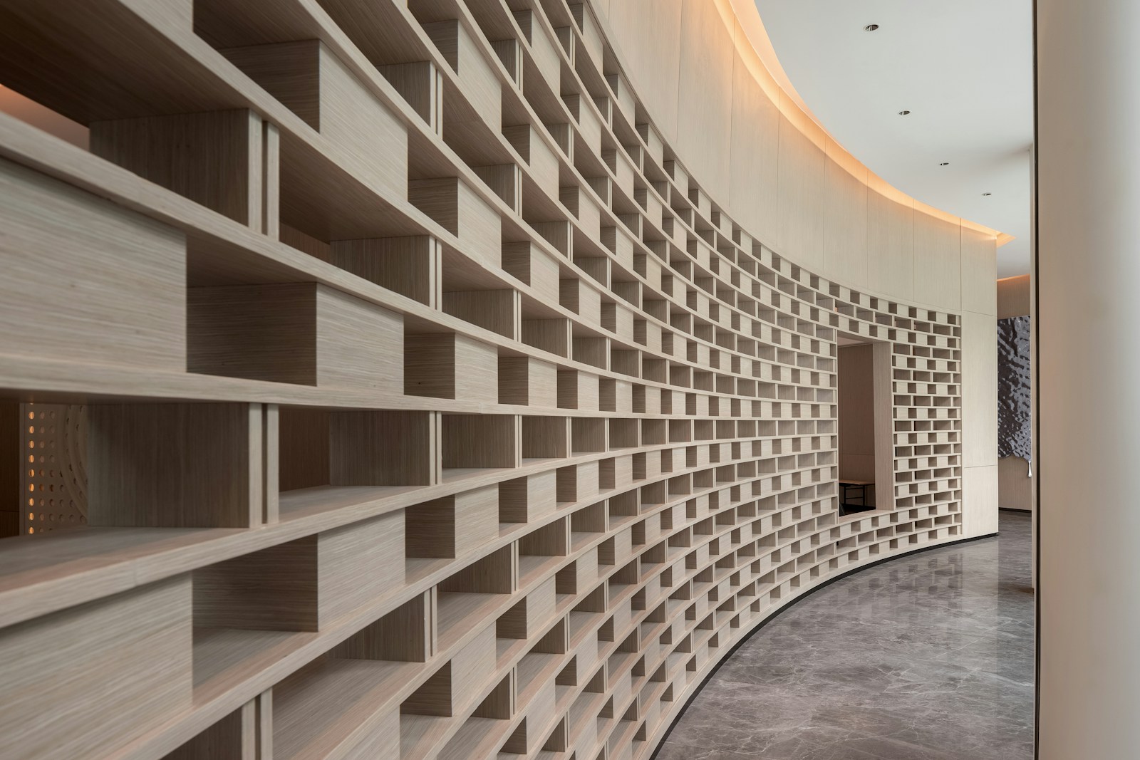 Curved wall with many small wooden shelves